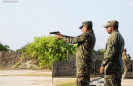Military personnel training with firearms at Girifushi. Live rounds were used almost daily in these training sessions prior to the ban. PHOTO: MIHAARU FILES