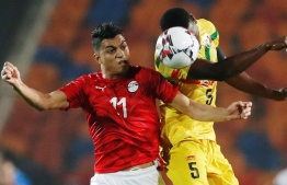 Mali's Youssouf Traore in action with Egypt's Mostafa Mohamed Africa Under 23 Cup of Nations at Cairo International Stadium in Egypt on November 8, 2019. PHOTO: REUTERS 