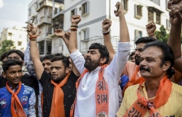 Supporters of the Vishwa Hindu Parishad (VHP) organisation celebrate the Indian Supreme Court's verdict on disputed religious site in Ayodhya awarded to Hindus, in Ahmedabad on November 9, 2019. - India's top court handed a huge victory to Prime Minister Narendra Modi's Hindu nationalist party on November 9 by awarding Hindus control of a bitterly disputed holy site that has sparked deadly sectarian violence in the past. (Photo by SAM PANTHAKY / AFP)