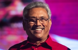 (FILES) In this file photo taken on November 13, 2019 Sri Lanka Podujana Peramuna (SLPP) party presidential candidate Gotabaya Rajapaksa smiles during a campaign rally in Homagama ahead of the November 16 presidential election. Sri Lanka's former wartime defence secretary Gotabaya Rajapaksa has been elected president, his spokesman said on November 17 following a fiercely fought election seven months after Islamist attacks killed 269 people.
Jewel SAMAD / AFP