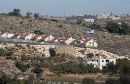 The Israeli settlement of Kyryat Arba in pictured in the occupied West Bank near the Palestinian town of Hebron on November 19, 2019. - Israeli Prime Minister Benjamin Netanyahu said a US statement deeming Israeli settlement not to be illegal "rights a historical wrong". But the Palestinian Authority decried the US policy shift as "completely against international law". Both sides were responding to an announcement by US Secretary of State Mike Pompeo saying that Washington "no longer considers Israeli settlements to be "inconsistent with international law". (Photo by HAZEM BADER / AFP)
