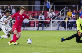 (FILES) In this file photo Josh Sargent #19 of the United States shoots the ball against Nelson Johnston #21 of Cuba during the first half at Audi Field on October 11, 2019 in Washington, DC. - Jordan Morris and teenager Josh Sargent scored two goals apiece as the United States eased into the final four of the CONCACAF Nations League on Tuesday with a 4-0 win over Cuba. (Photo by Scott Taetsch / GETTY IMAGES NORTH AMERICA / AFP)