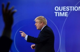 A handout picture taken and released by the BBC on November 22, 2019, shows Britain's Prime Minister Boris Johnson participating on the BBC's Question Time 'Leaders Special' television show, from Sheffield, northern England, that is set to feature the leaders of Britain's four main political parties. - Britain will go to the polls on December 12, 2019 to vote in a pre-Christmas general election. (Photo by JEFF OVERS / various sources / AFP) / RESTRICTED TO EDITORIAL USE - MANDATORY CREDIT " AFP PHOTO / JEFF OVERS-BBC " - NO MARKETING NO ADVERTISING CAMPAIGNS - DISTRIBUTED AS A SERVICE TO CLIENTS TO REPORT ON THE BBC PROGRAMME OR EVENT SPECIFIED IN THE CAPTION - NO ARCHIVE - NO USE AFTER **DECEMBER 12, 2019** / 
