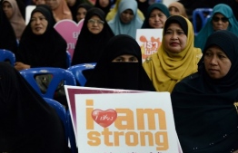 Local Muslims attend a meeting to listen and speak about family issues during an event to mark the international day for the elimination of violence against women, in the southern Thai province of Narathiwat on November 24, 2019. - The United Nation's "International Day for the Elimination of Violence against Women" will be marked globally on November 25. (Photo by Madaree TOHLALA / AFP)
