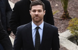 (FILES) In this file photo taken on January 22, 2019 Spain's retired midfielder Xabi Alonso arrives to attend a court hearing for tax evasion in Madrid. - Former Liverpool midfielder Xabi Alonso has been acquitted of tax fraud, a Madrid court announced on November 26, 2019. The prosecutors had intially demanded for him to face five years in jail before halving their request. Alonso, a World Cup winner with Spain in 2010, was accused of using a company based on the Portuguese island of Madeira to avoid paying 2 million euros ($2.2 million) in taxes on his image rights to the Spanish authorities. (Photo by PIERRE-PHILIPPE MARCOU / AFP)