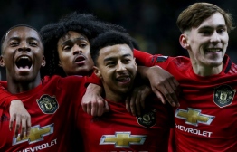 Manchester United's English midfielder Jesse Lingard celebrates with teammates after scoring a goal during the UEFA Europa League group L football match between Astana and Manchester United in Nur-Sultan on November 28, 2019. (Photo by stringer / AFP)