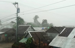 This handout image taken and received on December 2, 2019 courtesy of Gladys Vidal shows heavy rains and moderate wind from Typhoon Kammuri battering houses in Gamay town, Northern Samar province. The Philippines was braced for powerful Typhoon Kammuri as the storm churned closer, forcing evacuations and threatening plans for the Southeast Asian Games events near the capital Manila.

Handout / Courtesy of Gladys Vidal / AFP