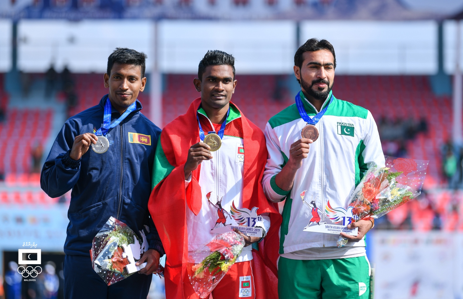 ހަސަން ސާއިދު (މ) ރަން މެޑަލް ދައްކާލަނީ. --އެމްއޯސީ ފޮޓޯ: ހުސެއިން ވަހީދު