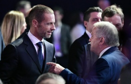 UEFA's president Aleksander Ceferin (L) arrives for the UEFA Euro 2020 football competition final draw in Bucharest on November 30, 2019. (Photo by Fabrice COFFRINI / AFP)