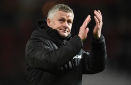 Manchester United's Norwegian manager Ole Gunnar Solskjaer applauds supporters as he leaves after the English Premier League football match between Manchester United and Aston Villa at Old Trafford in Manchester, north west England, on December 1, 2019. - The game finished 2-2. (Photo by Oli SCARFF / AFP) / RESTRICTED TO EDITORIAL USE. No use with unauthorized audio, video, data, fixture lists, club/league logos or 'live' services. Online in-match use limited to 120 images. An additional 40 images may be used in extra time. No video emulation. Social media in-match use limited to 120 images. An additional 40 images may be used in extra time. No use in betting publications, games or single club/league/player publications. / 