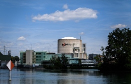 This picture taken on July 9, 2019, shows a general view of Switzerland's Beznau nuclear plant near Dottingen. - Europe's oldest functioning nuclear reactor, at Switzerland's Beznau plant, will turn 50 next week -- a lifespan deemed dangerously long by environmentalists who are demanding that it be shut down immediately. Commercial operation began at the plant in the northern canton of Aargau, near the German border, on December 9, 1969 -- back when The Beatles were still together and a man had just walked on the Moon. (Photo by Fabrice COFFRINI / AFP)