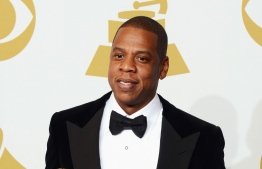 (FILES) In this file photo taken on February 10, 2013 Rapper Jay-Z, winners of Best Rap/Sung Collaboration and Best Rap Performance, poses in the press room at the 55th Annual GRAMMY Awards at Staples Center in Los Angeles, California. - Rap mogul Jay-Z celebrated his fiftieth birthday and surprised fans on December 4, 2019 by putting his catalog back on streaming giant Spotify, after a two-year hiatus. The billionaire artist, who owns rival streaming service Tidal, had pulled the majority of his discography from Spotify in 2017, months before dropping his "4:44" album exclusively on his own upstart platform. (Photo by Jason MERRITT / GETTY IMAGES NORTH AMERICA / AFP)