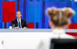 Russian Prime Minister Dmitry Medvedev gives a live interview on the annual results of the government work to journalists of Russia's television channels in Moscow on December 5, 2019. (Photo by Dmitry Astakhov / SPUTNIK / AFP)