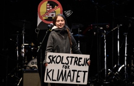 Swedish climate activist Greta Thunberg delivers a speech after a mass climate march to demand urgent action on the climate crisis from world leaders attending the COP25 summit, in Madrid, on December 6, 2019. - Thousands of activists from around the globe will simultaneously hit the streets of Madrid and Santiago on December 6, 2019. Teen eco-warrior Greta Thunberg -- who refuses to fly because of the carbon emissions involved -- is expected to join the rally after making a nearly three-week journey across the Atlantic by catamaran. She made a surprise appearance at the climate conference after she arrived in Madrid following a 10-hour overnight train trip from Lisbon, joining dozens of other youths in sit-in. (Photo by PIERRE-PHILIPPE MARCOU / AFP)