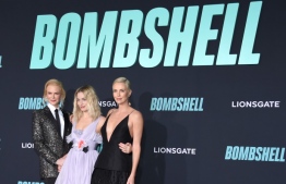 (L-R) Australian actress Nicole Kidman, Australian actress Margot Robbie and South African actress Charlize Theron arrive for Lionsgate's special screening of "Bombshell" at the Regency Village Theatre in Westwood, California on December 10, 2019. (Photo by LISA O'CONNOR / AFP)