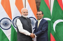 [File] Indian Prime Minister Narendra Modi meets with Parliament Speaker Mohamed Nasheed during his official trip to Maldives