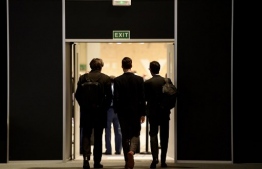 Delegates leave after a plenary session during the UN Climate Change Conference COP25 at the 'IFEMA - Feria de Madrid' exhibition centre, in Madrid, on December 14, 2019. - United Nations climate negotiations were deadlocked deep into overtime and through the night, with even the best-case outcome likely to fall well short of what science says is needed to avert a future ravaged by global warming. (Photo by CRISTINA QUICLER / AFP)