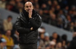 Manchester City's Spanish manager Pep Guardiola reacts on the touchline during the English Premier League football match between Manchester City and Manchester United at the Etihad Stadium in Manchester, north west England, on December 7, 2019. PHOTO: OLI SCARFF