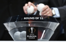 An official proceeds to the UEFA Europa League football cup round of 32 draw ceremony on December 16, 2019 in Nyon. (Photo by Fabrice COFFRINI / AFP)