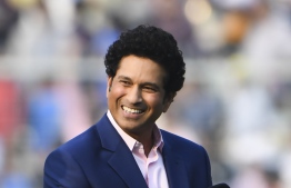 (FILES) In this file photo taken on November 22, 2019 former Indian cricketer Sachin Tendulkar attends the first day of of the second Test cricket match of a two-match series between India and Bangladesh at The Eden Gardens cricket stadium in Kolkata. - A hotel worker who gave India's cricket icon Sachin Tendulkar useful advice has been located after the batting maestro appealed to find him on internet. Tendulkar posted a video on Twitter recalling his meeting with the fan whom he believed was a waiter in the hotel and discussed bat swing with the former captain. (Photo by Dibyangshu SARKAR / AFP) / 