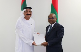 Foreign Minister Abdulla Shahid (R) presents the document, allocating a plot from the Hulhumale' Diplomatic Enclave for the UAE Embassy, to UAE's Ambassador-Designate Dr Saeed Mohamed Ali Al Shamsi on December 17, 2019. PHOTO/FOREIGN MINISTRY