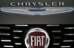 (COMBO) This combination of file pictures created on October 31, 2019, shows a Chrysler logo seen at the 2016 Washington Auto Show on January 27, 2015 in Washington, DC and a picture of the logo of Italian auto maker Fiat on January 12, 2017 in Saluzzo, near Turin. - French carmaker PSA and US-Italian rival Fiat Chrysler have signed an agreement to create the world's fourth largest automaker, they said in a joint statement on December 18, 2019. (Photos by Mandel Ngan and MARCO BERTORELLO / AFP)