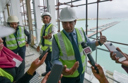 MACL Acting Manager Moosa Solih speaking to local media at the premises of the new seaplane terminal which is currently under construction. PHOTO: NISHAN ALI/ MIHAARU