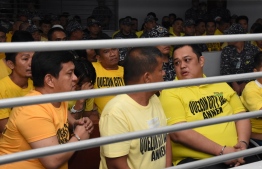 This handout photo from the Supreme Court - Public Information Office (SC-PIO)  taken and released on December 19, 2019 shows Andal Ampatuan Jnr (front L) and others accused of involvement in the 2009 Maguindanao massacre waiting to hear the court's verdict at the trial venue inside a prison facility in Manila. - The masterminds of the Philippines' worst political massacre were found guilty on December 19 of murdering 57 people, a rare conviction of powerful personalities in a country notorious for its culture of impunity. (Photo by Handout / SUPREME COURT - PUBLIC INFORMATION OFFICE / AFP) / -----EDITORS NOTE --- RESTRICTED TO EDITORIAL USE - MANDATORY CREDIT "AFP PHOTO / SUPREME COURT - PUBLIC INFORMATION OFFICE (SC-PIO)" - NO MARKETING - NO ADVERTISING CAMPAIGNS - DISTRIBUTED AS A SERVICE TO CLIENTS