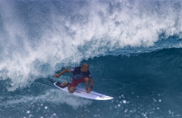 (FILES) In this file photo taken on December 16, 2018 US pro surfer Kelly Slater surfs during the Billabong Pipeline Masters on the north shore of Oahu in Hawaii. - Surfing legend Kelly Slater, seen by many as the greatest of all time, won't be competing at the Tokyo Olympics. (Photo by brian bielmann / AFP) / 