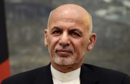 (FILES) In this file photo taken on July 12, 2016, Afghanistan's President Ashraf Ghani attends a press conference at the Presidential Palace in Kabul. - Afghanistan's President Ashraf Ghani was on track to win a second term on December 22, 2019, after election officials announced he had scored a majority in the presidential polls. (Photo by SHAH MARAI / AFP)
