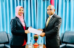 Minister Shahid presenting letter of appointment to Aminath Abdulla Didi as Consul General of the Maldivian Consulate in Thiruvananthapuram, India. PHOTO: FOREIGN MINISTRY