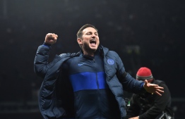 Chelsea's English head coach Frank Lampard celebrates their win on the pitch after the English Premier League football match between Tottenham Hotspur and Chelsea at Tottenham Hotspur Stadium in London, on December 22, 2019. - Chelsea won the game 2-0. (Photo by Glyn KIRK / IKIMAGES / AFP) / 