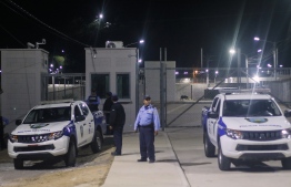Members of Honduras' National Police patrol the entrance of El Porvenir prison, in the department of Francisco Morazan Honduras, on December 22, 2019. - Eighteen people were killed on December 22 in violence between prisoners at a jail in central Honduras, less than two days after another 18 died in unrest at a separate facility, a military spokesman told local media. The spokesman for the combined national security force known as Fusina released a list of names of the 18 dead and two injured, saying that "firearms, knives and machetes" were used in the clash in El Porvenir prison north of the capital Tegucigalpa. (Photo by STR / AFP)