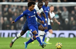 Chelsea's Brazilian midfielder Willian passes the ball during the English Premier League football match between Tottenham Hotspur and Chelsea at Tottenham Hotspur Stadium in London, on December 22, 2019. (Photo by Glyn KIRK / IKIMAGES / AFP) / 