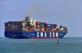 (FILES) In this file photo taken on March 29, 2019 A cargo ship loaded with containers departs from the Chinese-majority owned Colombo International Container Terminal (CICT) in Colombo on March 29, 2019. - Business leaders from the shipping industry are in London on November 11, 2019 discussing the rules to be implemented in order to reach a target of reducing 40% of its greenhouse gas emissions by 2030. (Photo by ISHARA S. KODIKARA / AFP)