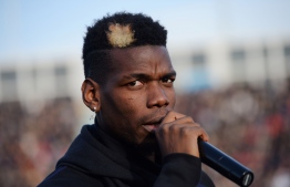 Manchester United and France midfielder Paul Pogba speaks prior to a gala football match between All Star France and Guinea at the Vallee du Cher Stadium in Tours, central France, on December 29, 2019, as part of the "48h for Guinea" charity event. (Photo by GUILLAUME SOUVANT / AFP)