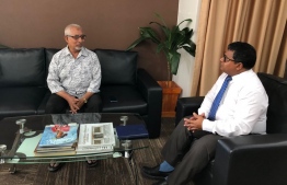 Minister of Environment Dr Hussain Rasheed Hassan meeting with a citizen to discuss concerns. PHOTO: MINISTRY OF ENVIRONMENT