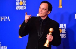 US film director Quentin Tarantino poses in the press room with the award for Best Screenplay - Motion Picture during the 77th annual Golden Globe Awards on January 5, 2020, at The Beverly Hilton hotel in Beverly Hills, California. (Photo by FREDERIC J. BROWN / AFP)