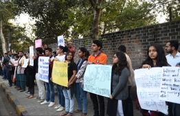 Students and supporters hold placards during a protest against an attack on the students and teachers at the Jawaharlal Nehru University (JNU) campus in New Delhi a day before, outside the Indian Institute of Management (IIM) in Ahmedabad on January 6, 2020. - Protests were held across India on January 6 after masked assailants wielding batons and iron rods went on a rampage at a top Delhi university, leaving more than two dozen injured. (Photo by SAM PANTHAKY / AFP)