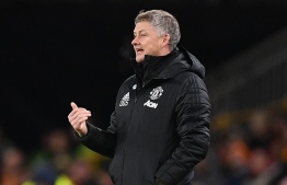 Manchester United's Norwegian manager Ole Gunnar Solskjaer gestures on the touchline during the FA Cup third round football match between Wolverhampton Wanderers and Manchester United at the Molineux stadium in Wolverhampton, central England on January 4, 2020. (Photo by Justin TALLIS / AFP) / RESTRICTED TO EDITORIAL USE. No use with unauthorized audio, video, data, fixture lists, club/league logos or 'live' services. Online in-match use limited to 120 images. An additional 40 images may be used in extra time. No video emulation. Social media in-match use limited to 120 images. An additional 40 images may be used in extra time. No use in betting publications, games or single club/league/player publications. / 