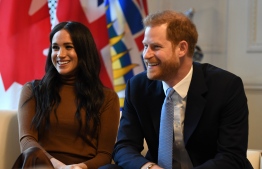 Britain's Prince Harry, Duke of Sussex and Meghan, Duchess of Sussex react during their visit to Canada House in thanks for the warm Canadian hospitality and support they received during their recent stay in Canada,  in London on January 7, 2020. (Photo by DANIEL LEAL-OLIVAS / POOL / AFP)