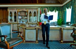 President Ibrahim Mohamed Solih, in his official quarters, as he reviews the Minimum Wage Bill for Maldives. PHOTO: PRESIDENCY MALDIVES
