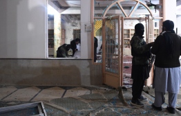 Security officials examine the site after a bomb blast in a mosque in Quetta on January 10, 2020. - At least 10 people were killed and 16 others wounded in a bomb blast during evening prayers at a mosque in southwestern Pakistan on January 10, police and a doctor said. (Photo by BANARAS KHAN / AFP)