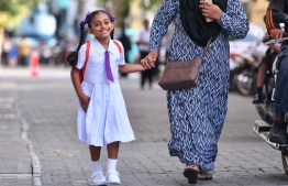 A student on the way to school.-- Photo: Mihaaru