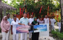LUX* South Ari Atoll's General Manager (C-L) Jonas Amstad and Minister of Gender, Family and Social Services, Shidatha Shareef (C-L) during the donation ceremony. PHOTO: MINISTRY OF GENDER, FAMILY AND SOCIAL SERVICES