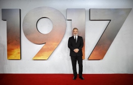 (FILES) In this file photo taken on December 4, 2019 British film director Sam Mendes poses on the red carpet as he arrives to attend the World premiere and Royal Film Performance of the film "1917" in London in support of the film and TV charity. - Universal's war drama "1917" took command of the North American box office this weekend, riding its Golden Globes success to earn an estimated $36.5 million, industry watcher Exhibitor Relations reported on January 12, 2020. The film's unexpectedly strong showing was timely, with Oscar nominations set to be announced on Monday. Last Sunday it won Golden Globes -- often a predictor of Oscar success -- for both best drama and best director (Sam Mendes). (Photo by Tolga Akmen / AFP)