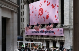 (FILES) In this file photo taken on April 18, 2019, a banner for the online image board Pinterest Inc. hangs from the New York Stock Exchange (NYSE) on the morning that Pinterest Inc. makes its initial public offering in New York City. - Shares in Pinterest popped on January 14, 2020. after a market tracker reported that the online bulletin board surpassed Snapchat to become the third most used social media platform in the US. (Photo by SPENCER PLATT / GETTY IMAGES NORTH AMERICA / AFP)