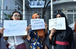 Citizens stage a protest against rape and sexual violence in front of the gender ministry, following the sexual abuse of a toddler by her paternal grandfather and great-grandfather in GA.Kanduhulhudhoo. FILE PHOTO/MIHAARU