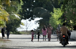 Children stroll through the Island of Kanduhulhudhoo, Gaafu Dhaalu Atoll. PHOTO: NISHAN ALI / MIHAARU