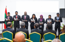 The seven new judges taking their oaths during the ceremony at DJA. PHOTO: HUSSAIN WAHEED